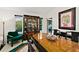 Elegant dining room featuring a dark wood table, chairs, and display cabinet at 7 Jasmine Run, Ormond Beach, FL 32174