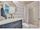 Elegant bathroom with dark vanity, marble countertops, and gold accents at 133 Blue Heron Dr # C, Daytona Beach, FL 32119