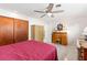 Cozy bedroom with built-in desk and ceiling fan at 2329 Oriole Ln, South Daytona, FL 32119