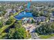 Aerial view of apartment community with lake, pool, and lush landscaping at 940 Village Trail # 7-107, Port Orange, FL 32127