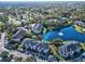 Aerial view of condo building near lake with fountain at 940 Village Trail # 7-107, Port Orange, FL 32127