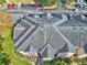 Aerial view of condo building showcasing building features and landscaping at 940 Village Trail # 7-107, Port Orange, FL 32127
