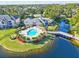 Community pool and lakefront views at 940 Village Trail # 7-107, Port Orange, FL 32127