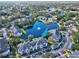 Aerial view of condo building near lake with fountain at 940 Village Trail # 7-107, Port Orange, FL 32127