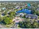 Aerial view highlighting apartment building near lake and community amenities at 940 Village Trail # 7-107, Port Orange, FL 32127