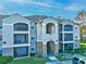 Two-story building with balconies and stone accents at 940 Village Trail # 7-107, Port Orange, FL 32127