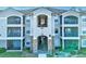 Two-story building with balconies and stone accents at 940 Village Trail # 7-107, Port Orange, FL 32127