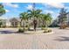 Community center with fountain and palm trees at 940 Village Trail # 7-107, Port Orange, FL 32127