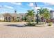 Community center with fountain and palm trees at 940 Village Trail # 7-107, Port Orange, FL 32127