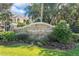 Community entrance sign for Villaggio on the Lakes at 940 Village Trail # 7-107, Port Orange, FL 32127