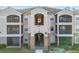 Two-story building with balconies and stone accents at 940 Village Trail # 7-107, Port Orange, FL 32127