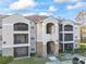 Two-story building with balconies and stone accents at 940 Village Trail # 7-107, Port Orange, FL 32127