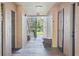 Shared hallway leading to the unit with pond view at 940 Village Trail # 7-107, Port Orange, FL 32127