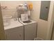 Laundry room with washer and dryer included at 940 Village Trail # 7-107, Port Orange, FL 32127