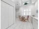 Kitchen breakfast nook with white cabinets and window at 1113 Athlone Way, Ormond Beach, FL 32174