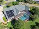 House with solar panels and a large screened pool at 501 Oyster Bay Dr, Ormond Beach, FL 32174