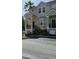 Townhouse with balconies, stairs, and a paved driveway at 6550 Time Square Ave # 105, Orlando, FL 32835