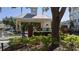 Gated community entrance with lush landscaping and brick accents at 6550 Time Square Ave # 105, Orlando, FL 32835