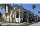 Exterior view of charming townhouses with attractive landscaping at 6550 Time Square Ave # 105, Orlando, FL 32835
