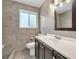 Bathroom boasts dark vanity, tile shower, and flooring at 747 Derbyshire Rd, Daytona Beach, FL 32114