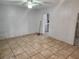 Tiled dining room with a ceiling fan and an open doorway leading to another room at 118 Deacon Jones Blvd, Orlando, FL 32810