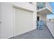 Spacious balcony with outdoor furniture and a roller shutter at 1183 Ocean Shore Blvd # 1040, Ormond Beach, FL 32176