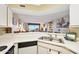 Bright kitchen with white appliances, double sink, and ocean view at 1183 Ocean Shore Blvd # 1040, Ormond Beach, FL 32176