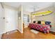 Inviting den with daybed, decorative surfboard, and entryway access at 1183 Ocean Shore Blvd # 1040, Ormond Beach, FL 32176