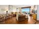Bright, airy living area with parquet flooring, comfortable furniture, and ocean views at 1183 Ocean Shore Blvd # 1040, Ormond Beach, FL 32176