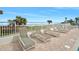 Lounge chairs by the pool offer breathtaking ocean views at 1183 Ocean Shore Blvd # 1040, Ormond Beach, FL 32176