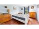 Bedroom with white wooden bedframe, dresser, and desk at 17 Cameo Cir, Ormond Beach, FL 32174