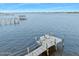 Private dock with seating area extends into the water, perfect for enjoying waterfront views at 17 Cameo Cir, Ormond Beach, FL 32174