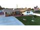 An aerial view of a single-story home with a driveway and front yard at 21 Sunset Blvd, Ormond Beach, FL 32176