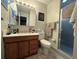 Practical bathroom featuring a shower, single vanity, and toilet at 21 Sunset Blvd, Ormond Beach, FL 32176