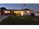 Inviting front yard with lush green lawn and an American flag at 21 Sunset Blvd, Ormond Beach, FL 32176