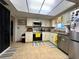 Bright kitchen featuring white cabinets, stainless steel appliances, and tile floors at 21 Sunset Blvd, Ormond Beach, FL 32176