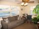 Cozy living room with comfortable couch, rocking chair, and large windows at 21 Sunset Blvd, Ormond Beach, FL 32176