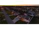 Aerial view of home in a residential neighborhood near the water at sunset at 21 Sunset Blvd, Ormond Beach, FL 32176