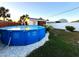 Backyard with above-ground pool and storage shed at 21 Sunset Blvd, Ormond Beach, FL 32176