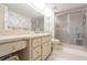 Bathroom with floral wallpaper and a walk-in shower at 2294 Ocean Shore Blvd # 1020, Ormond Beach, FL 32176