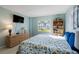 Spacious bedroom with large TV and dresser at 2294 Ocean Shore Blvd # 1020, Ormond Beach, FL 32176