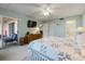 Primary bedroom with large TV and access to balcony at 2294 Ocean Shore Blvd # 1020, Ormond Beach, FL 32176