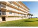 Oceanfront building with balconies and grassy area at 2294 Ocean Shore Blvd # 1020, Ormond Beach, FL 32176