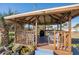 Wooden gazebo with seating and grill at 2294 Ocean Shore Blvd # 1020, Ormond Beach, FL 32176