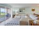 Living room with sectional sofa and sliding glass doors to patio at 2294 Ocean Shore Blvd # 1020, Ormond Beach, FL 32176