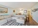 Living room with sectional sofa, wood floors, and ocean view at 2294 Ocean Shore Blvd # 1020, Ormond Beach, FL 32176