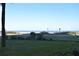 Scenic ocean view with a grassy area and a road in the foreground at 2294 Ocean Shore Blvd # 1020, Ormond Beach, FL 32176