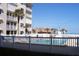 Community pool with white fence at beachfront condo property at 2294 Ocean Shore Blvd # 1020, Ormond Beach, FL 32176