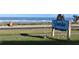 Sunrise Beach Condominiums sign with the ocean in the background at 2294 Ocean Shore Blvd # 1020, Ormond Beach, FL 32176
