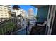 Relaxing balcony with views of surrounding buildings and palm trees at 2727 N Atlantic Ave # 203, Daytona Beach, FL 32118